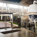 Cctv,Camera,Operating,In,Front,Of,Glass,Door